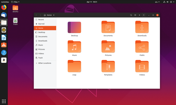 Ubuntu 19,04 manajer file dengan ikon desktop di latar belakang